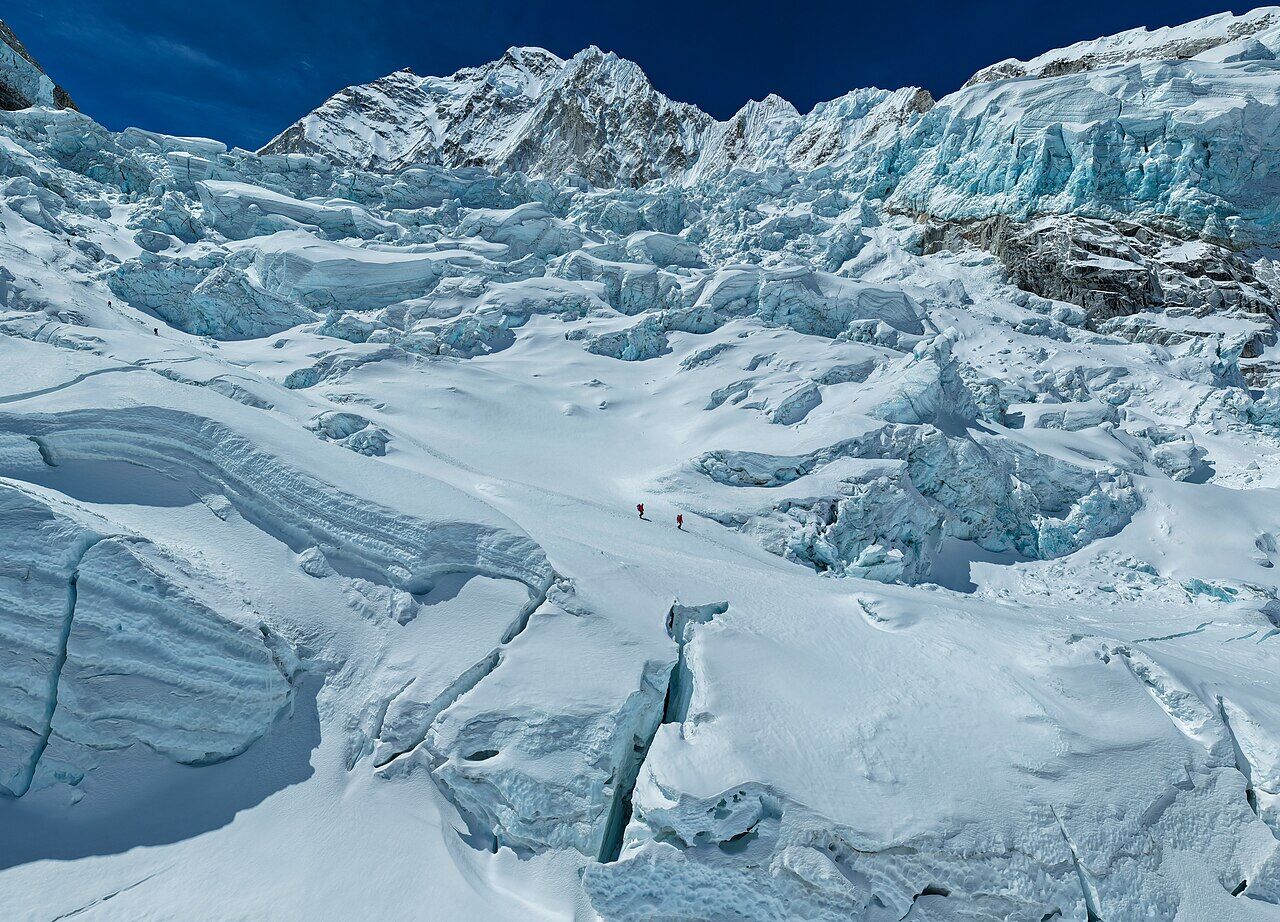 Two climbers among seracs in the Khumbu Icefall